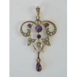 A delightful 9ct gold Edwardian amethyst and seed pearl pendant of foliate form,