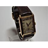 An early 20th century gents 9ct gold tank style watch with Swiss hand wind movement.