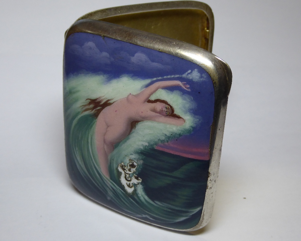 An early 20th Century German heavy enamelled white metal cigarette case depicting a naked maiden