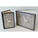 A HM silver and leather bound address book with matching dictionary,