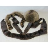 Vintage furs; a raccoon fur stole, two other stoles and a hat.