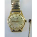 A Colant wristwatch having champagne dial with yellow metal hands,