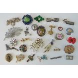 A quantity of assorted 20th century brooches including; a 'fob watch' set with faux turquoise,
