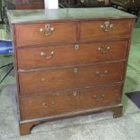 An Edwardian chest of two short over three long drawers, 110cm wide.