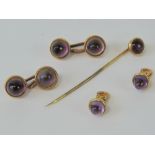 An amethyst and yellow metal set of cufflinks, tie pin and collar studs. Total weight 22.2g.