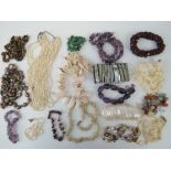 A quantity of assorted bead necklaces including; amethyst, tigers eye, shell, etc.