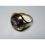 A 14ct gold ring set with a large light coloured amethyst, stone approx 14mm diameter.