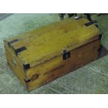 A dome top studded lidded trunk having paper interior, complete with brass end handles, 76cm wide.
