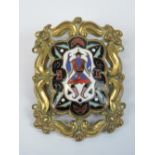 A Victorian brooch having central cloisonné panel depicting Chinese man, pinchbeck frame, 5 x 3.5cm.