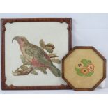 A Victorian needlework panel of a parrot upon branch within mahogany firescreen frame, 43cm wide.