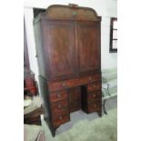 An unusual Georgian mahogany linen press having twin doors opening to reveal compartment within