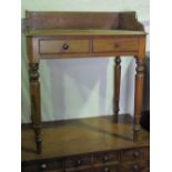 A smart twin drawer mahogany wash stand raised over turned legs.