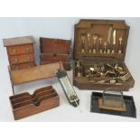 A canteen of Siamese cutlery and flatware, a miniature chest of three drawers, book rack,