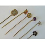 A 15ct gold and diamond stick pin,