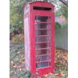 An iconic vintage British red K6 telephone box in unrestored a/f condition including two loose