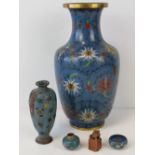 A cloisonné ovoid vase with flower heads and foliage on a blue ground, 33cm high, a/f,