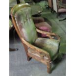 A mahogany framed open arm high back drawing room chair.