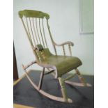 An unusual late 19th century pine and ash rocking chair having deep curved seat and extra turned H