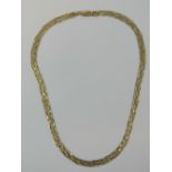 A 9ct gold necklaces having six strands of white and yellow gold woven together, hallmarked 375,