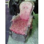 A single oval unpainted salon chair having floral upholstery.
