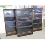 Three four sectional Globe Wernicke style glazed 'up and over' library bookcases in stained oak,