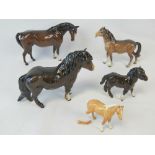 A Beswick Woolly Shetland mare and foal, together with three a/f Beswick horses. Five items.