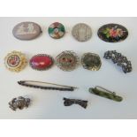 A quantity of vintage brooches including; a Wedgwood lilac jasperware brooch,