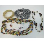A vintage three strand hardstone bead necklace,
