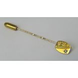 A 9ct gold and diamond stick pin, round cut diamond is star setting upon half floral engraved head,