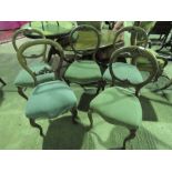 Five mahogany 19th century balloon back dining chairs with matching upholstery.