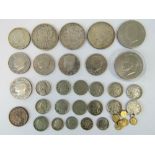 A quantity of USA coinage including; an 1884 Morgan silver dollar, a 1902 Morgan silver dollar,