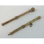 A delightful rose metal retracting pencil having engraved floral design to octagonal barrel