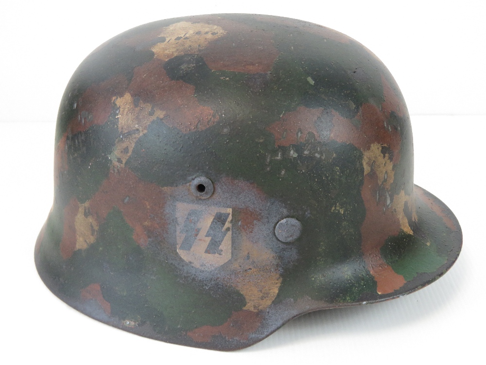 A fine replica WWII German SS Infantry helmet with single decal and 'Splotch' style camouflage