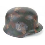 A fine replica WWII German SS Infantry helmet with single decal and 'Splotch' style camouflage