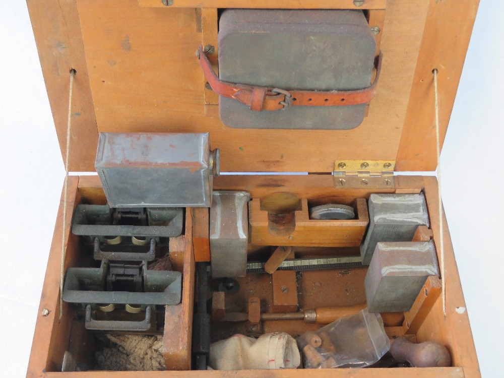 A WWII British military Vickers Armourers tool and spares chest with parts and tools , dated 1943. - Image 2 of 2