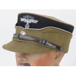 A rare WWII German NSKK Officers kepi, stiffened peak with silver thread piping,