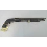 A deactivated Mossberg M500 12 gauge pump action shotgun with 16" barrel and Pachmyer rubber pistol