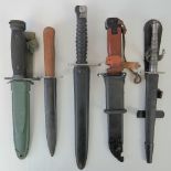 Five military knives and bayonets including; U.S. M16, Soviet AKM and WWII German boot knife.