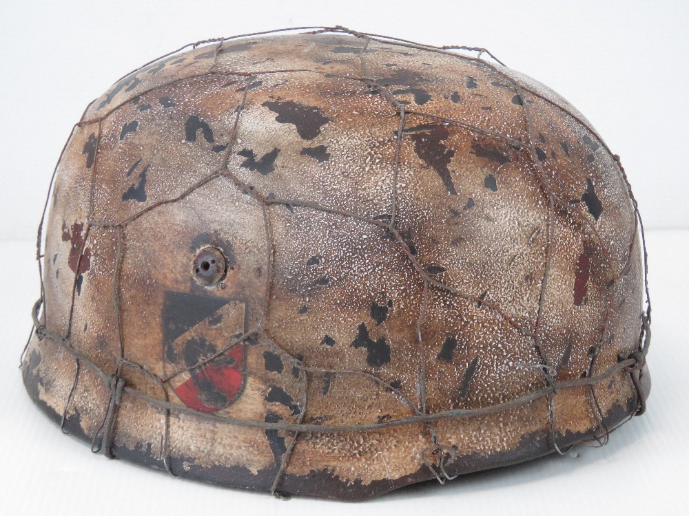 A fine replica WWII Luftwaffe Paratroopers Fallschirmjäger helmet with two decals,