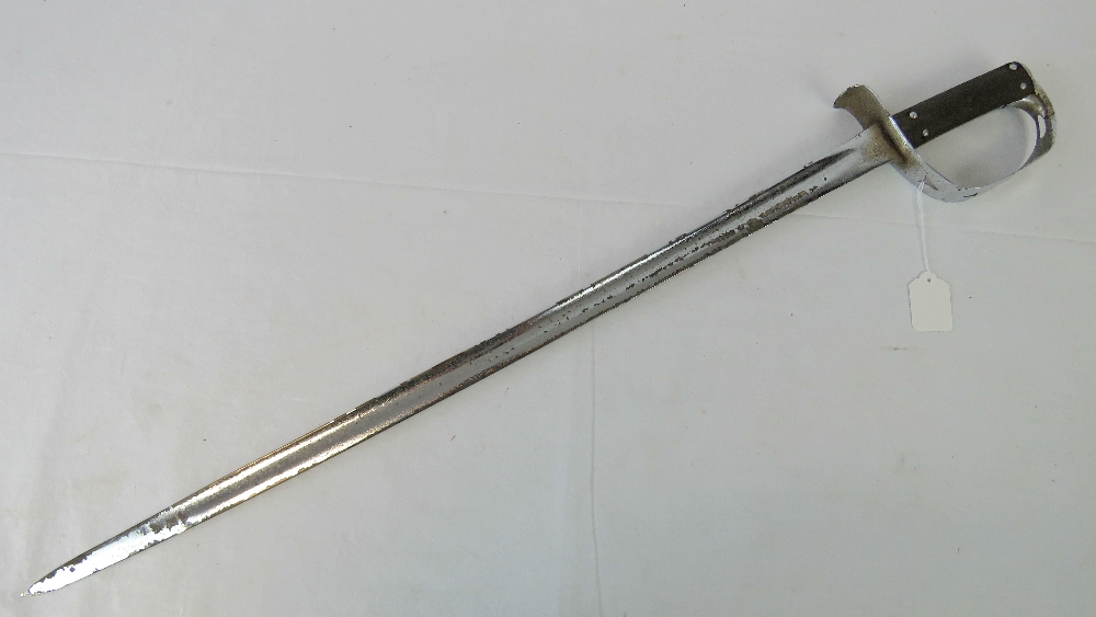 A sword having cut down blade and white metal guard, blade measuring 72.5cm.