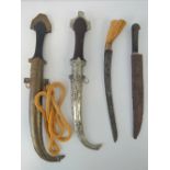 Two Jambiya daggers each having metal covered sheath, together with two hunting knives. Four items.