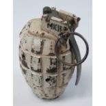 An inert British WWII Mk2 Mills grenade, painted in Artic /Winter camouflage, fuse plug dated 1945.