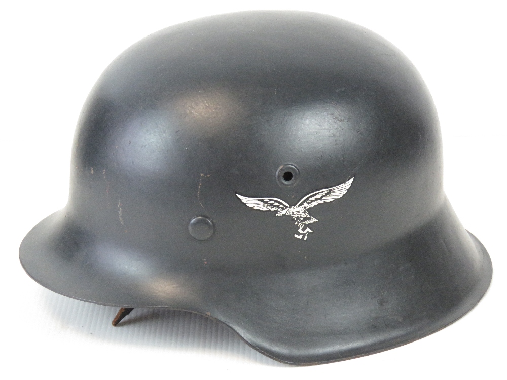 A fine replica WWII Luftwaffe helmet having single decal, liner and chinstrap.