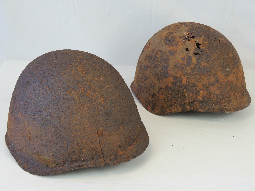 Two WWII Russian helmets in relic condit