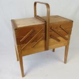 A vintage cantilever sewing box having t