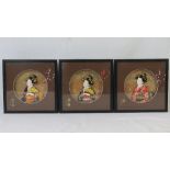 Three framed relief geisha girl busts in