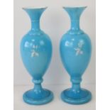 A pair of blue white cased art glass vas