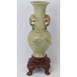 A heavy soapstone baluster vase with ele