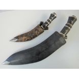 Two Kukri knives with leather sheaths, o