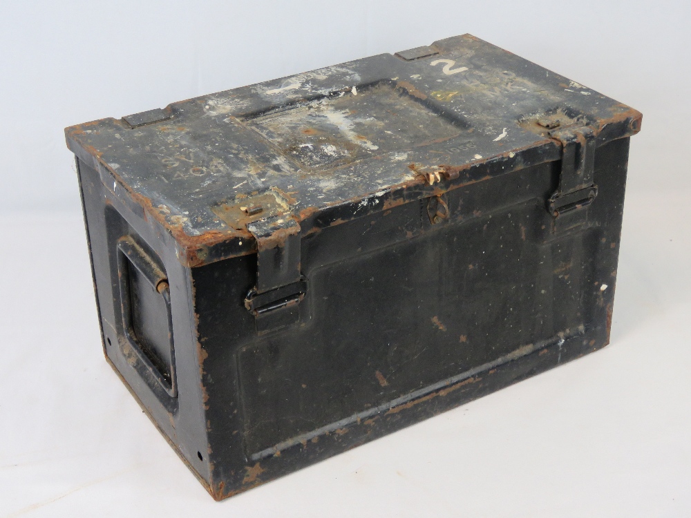 A metal ammo box dated 1956 and measurin